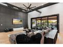 Bright living room featuring a large sectional sofa and access to the patio at 2225 N 38Th Way, Phoenix, AZ 85008