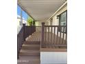 Inviting porch with wood-look stairs and railing, perfect for relaxing outdoors at 2233 E Behrend Dr # 29, Phoenix, AZ 85024