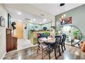 Cozy dining room boasts stylish lighting, hardwood floors, and an open connection to the kitchen at 2302 N Central Ave # 311, Phoenix, AZ 85004