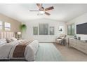 Large main bedroom with ceiling fan, neutral paint, and natural light at 4507 E Lantern Pl, Gilbert, AZ 85297