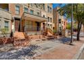 Townhome showcasing an inviting front porch and well-maintained landscaping at 581 S Roosevelt St, Tempe, AZ 85281