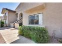 A charming exterior view of the home showcasing the well-maintained grounds and stucco facade at 9450 N 94Th Pl # 116, Scottsdale, AZ 85258