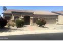 Charming single-story home featuring a well-manicured lawn and a two-car garage at 1390 E Jasper Dr, Gilbert, AZ 85296