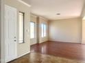 Bright living room boasting an abundance of natural light, enhanced by elegant trim and neutral decor at 1390 E Jasper Dr, Gilbert, AZ 85296