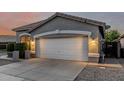 Charming single-story home featuring a two-car garage and desert landscaping at 20858 E Sonoqui Dr, Queen Creek, AZ 85142