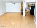 Spacious living room with light wood floors and natural light streaming in at 2103 W Missouri Ave, Phoenix, AZ 85015