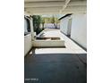 Covered patio with concrete flooring and block accents, ideal for outdoor living at 2103 W Missouri Ave, Phoenix, AZ 85015