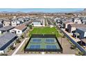 Community pickleball courts with lush green surroundings in a well-maintained neighborhood at 2583 E Music Mountain Ave, Apache Junction, AZ 85119