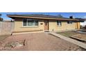 Charming single-story home featuring a neutral-toned exterior, well-maintained lawn, and inviting front entrance at 2724 W Highland Ave, Phoenix, AZ 85017