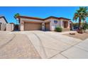 Spacious home with a three-car garage, desert landscaping, and a charming front exterior at 3114 E Capricorn Way, Chandler, AZ 85249