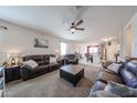 Open-concept living room flows into the kitchen, perfect for entertaining and Gathering gatherings at 4088 N 309Th Cir, Buckeye, AZ 85396