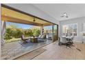 Open dining area with large glass doors leading to the covered patio at 6948 E Quill St, Mesa, AZ 85207