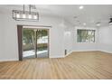 Open living area with sliding doors, wood-look floors, recessed lighting, and lots of natural light at 7601 E Roosevelt St # 1012, Scottsdale, AZ 85257
