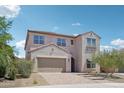 Charming home with a tile roof, desert landscaping, and a two-car garage at 10158 W Angels Ln, Peoria, AZ 85383