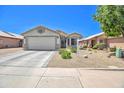 Beautiful single-story home featuring desert landscaping and a two-car garage at 10951 E Delta Ave, Mesa, AZ 85208