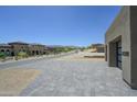 Expansive, modern home featuring paver driveway and desert landscaping in an upscale neighborhood at 13290 E La Junta Rd, Scottsdale, AZ 85255