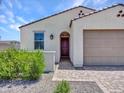 Charming single-story home with a desert landscape, arched entry and a two car garage at 15817 S 177Th Dr, Goodyear, AZ 85338
