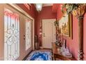 Inviting entryway with decorative glass doors, rich color palette, and elegant details at 1702 W Monterosa W St, Phoenix, AZ 85015