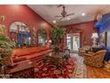 Spacious living room featuring vaulted ceilings, elegant furnishings, and access to the outdoors at 1702 W Monterosa W St, Phoenix, AZ 85015