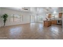 Open-concept living area featuring tile floors and lots of natural light at 17844 W Caribbean Ln, Surprise, AZ 85388