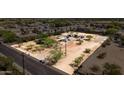 Wide lot featuring mature trees and gravel areas, complete with gated access and street frontage at 1851 E Campo Bello Dr, Phoenix, AZ 85022