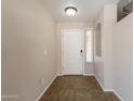 Welcoming entryway featuring tile flooring, neutral paint, and a front door for a clean and modern look at 22196 W Tonto St, Buckeye, AZ 85326