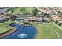 Community aerial view featuring the golf course, clubhouse, pool, and surrounding residential area at 23756 S Vacation Way, Sun Lakes, AZ 85248
