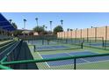 Well-maintained pickleball courts with green and blue surfaces and protective fencing for active recreation at 23756 S Vacation Way, Sun Lakes, AZ 85248