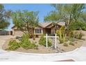 Inviting single-story home with desert landscaping and a well-manicured front yard at 28814 N 45Th St, Cave Creek, AZ 85331