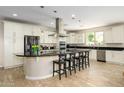 Spacious kitchen with a large island, stainless steel appliances, and sleek countertops at 3247 E Creosote Ln, Gilbert, AZ 85298