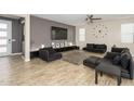 Modern living room with hardwood floors, neutral colors, and comfortable seating at 3247 E Creosote Ln, Gilbert, AZ 85298