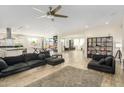 Open-concept living area with hardwood floors, comfortable sofas, and plenty of natural light at 3247 E Creosote Ln, Gilbert, AZ 85298