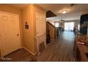 Entryway featuring neutral paint colors, wood floors and a staircase at 41228 W Little Dr, Maricopa, AZ 85138