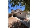 Two-story home featuring desert landscaping, covered entry way, and a two car garage at 41228 W Little Dr, Maricopa, AZ 85138