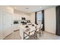 Bright kitchen featuring stainless steel appliances and a center island with seating at 4792 E Shasta Dr, San Tan Valley, AZ 85143