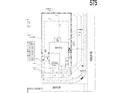 Plot plan showing lot dimensions, driveway, and covered patio at 4993 S 254Th Dr, Buckeye, AZ 85326