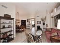 Open concept living room showcasing tile floors, neutral walls, and elegant furnishings at 6966 E Bramble Berry Ln, Scottsdale, AZ 85266