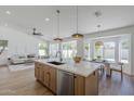 Stylish kitchen featuring a large island with seating and modern fixtures at 7144 E Lakeview Ave, Mesa, AZ 85209