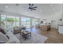 Bright and airy living room featuring large windows and an open floor plan at 7144 E Lakeview Ave, Mesa, AZ 85209