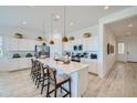 Modern kitchen featuring a large island with seating, stainless steel appliances, and ample cabinet space at 870 W Peralta Pass, Apache Junction, AZ 85120
