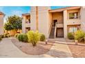Charming apartment complex featuring well-maintained landscaping and inviting walkways to the entrances at 9450 N 94Th Pl # 205, Scottsdale, AZ 85258