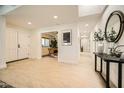 Bright entryway featuring tile floors, white walls, a skylight, and an arched doorway at 10023 E Sunnyslope Ln, Scottsdale, AZ 85258