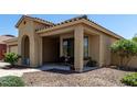 Charming single-story home with a cozy front porch, desert landscaping, and neutral color scheme at 11755 W Patrick Ln, Sun City, AZ 85373