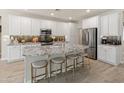 Bright kitchen with a large island, granite countertops, and stainless steel appliances at 13186 W Via Dona Rd, Peoria, AZ 85383