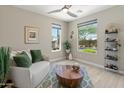 Bright living room with views of the garden and pool and with elegant decor and lots of natural light at 13186 W Via Dona Rd, Peoria, AZ 85383