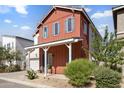 Charming two-story home with a covered front porch and an attached two-car garage at 15718 W Polk St, Goodyear, AZ 85338