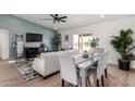Comfortable living room adjacent to the dining area, with stylish decor at 16630 N Slate Ln, Maricopa, AZ 85139
