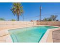 Backyard swimming pool with light blue water and surrounding patio area at 1811 W Roma Ave, Phoenix, AZ 85015