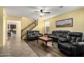 Spacious living room featuring wood and tile flooring and lots of room for entertaining at 2993 E Meadowview Dr, Gilbert, AZ 85298