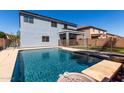 Backyard pool with a covered patio and fenced-in area at 30165 W Flower St, Buckeye, AZ 85396
